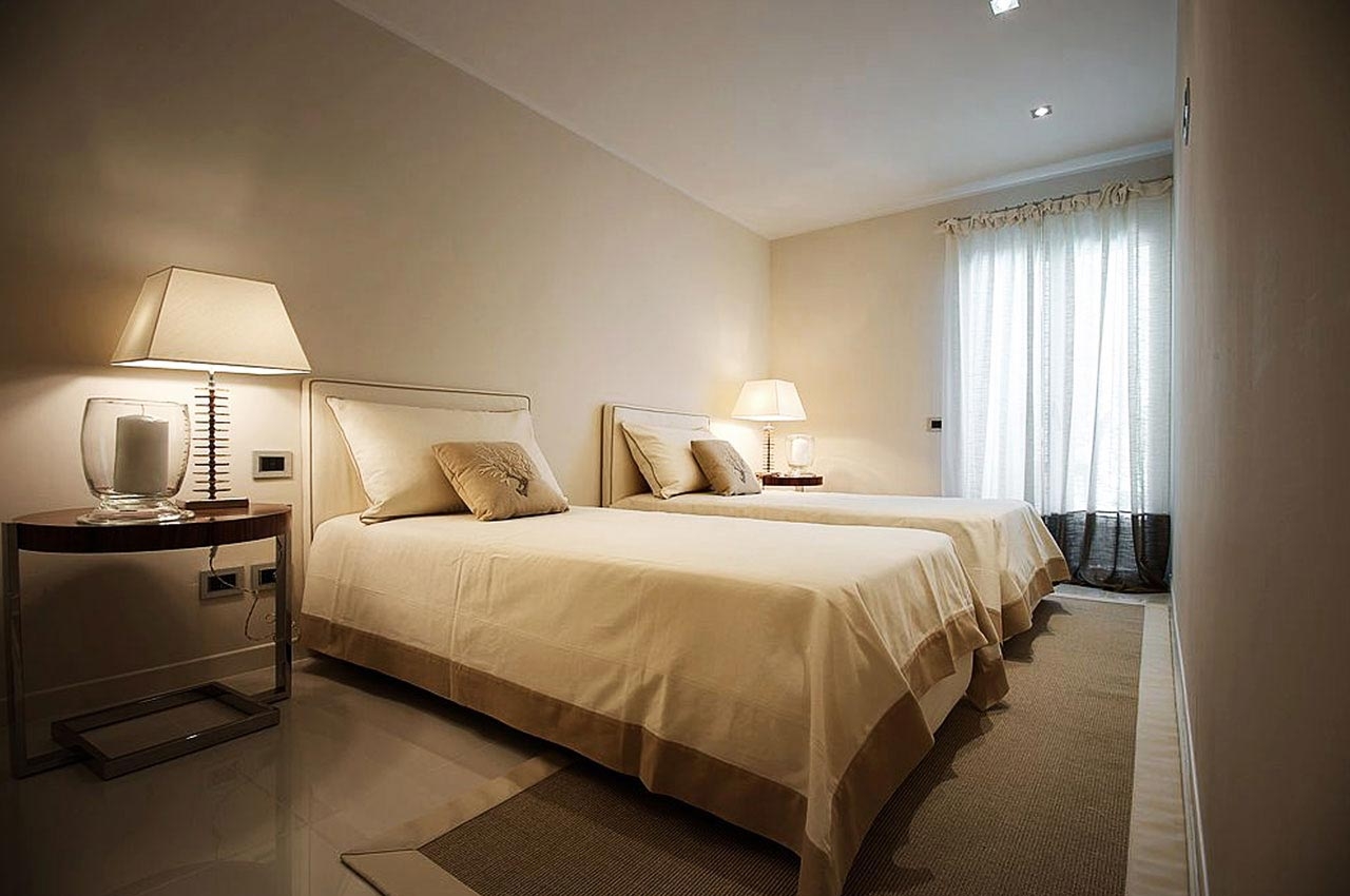 On bedside tables of the master bedroom, pair of table lamps with real agate stones