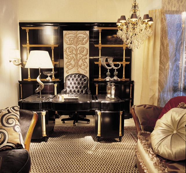 On the writing desk our table lamp MUFLONE, real natural horn, and a pair of candlestick and empty pocket with real horn too.  On a level of the bookshelf two ABUNDANCE HORNS hand chiseled with marble spheres, while on the other side the FESTONE bowl in French gold finish.  On the wall, lamp with real horn MUFLONE with ivory shantung shade.
